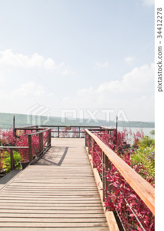 Wooden walkway in the garden on the mountain Wooden walkway in the garden on the mountain 34412278