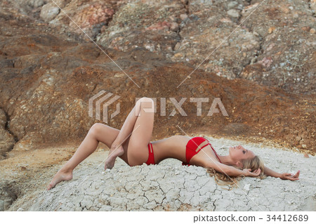 beautiful girl in a bikini on the beach beautiful girl in a bikini on the beach 34412689