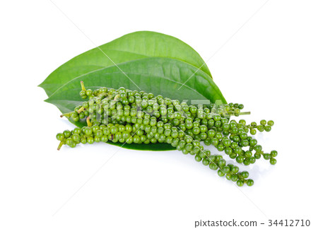pile of fresh peppercorns with leaf on white 34412710