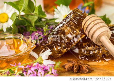 natural organic honey on a wooden table. natural organic honey on a wooden table. 34416297