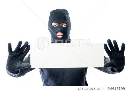Robber in black clothes and mask with a poster Robber in black clothes and mask with a poster 34417199