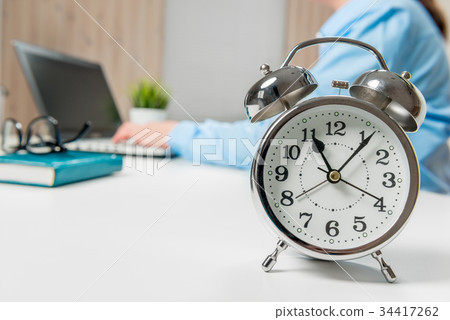 Businesswoman working in the office, in focus Businesswoman working in the office, in focus 34417262