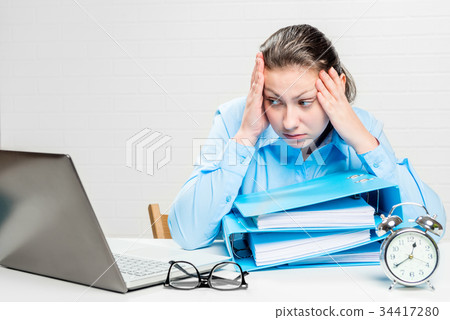 Conceptual picture of a tired businesswoman Conceptual picture of a tired businesswoman 34417280