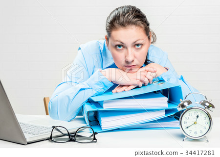 frustrated and tired accountant with folders works frustrated and tired accountant with folders works 34417281