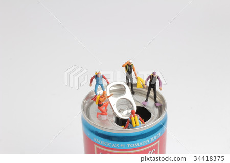 small  diver stands on an open aluminum can 34418375
