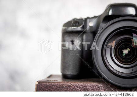 Close up of the slr camera with lens. Close up of the slr camera with lens. 34418608