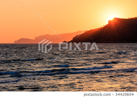 Sunset on sea beach 34420604