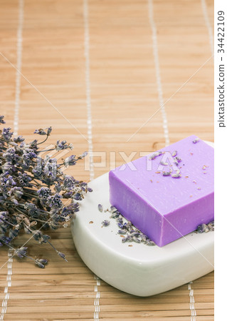 Bar of natural lavandah soap on white soap dish Bar of natural lavandah soap on white soap dish 34422109