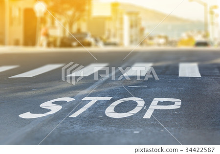 City crosswalk with symbol stop 34422587