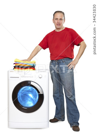 happy man with new washing machine. 34423830