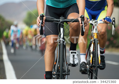 Cycling competition,cyclist athletes riding a race 34425360