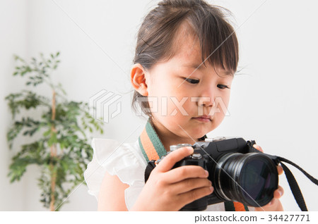 A girl with a camera 34427771