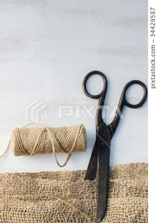 Old scissors, skein jute twine and burlap. 34429587
