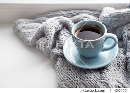 cozy soft gray blanket with a cup of coffee 34429615