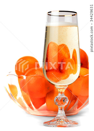 Snifter of champagne with tangerines 34429631