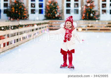 Kids ice skating in winter. Ice skates for child. Kids ice skating in winter. Ice skates for child. 34429995