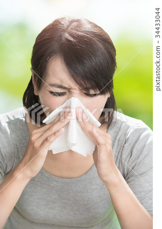 woman blowing nose 34433044
