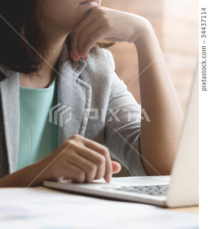 Asian Business woman with laptop  thinking. Asian Business woman with laptop  thinking. 34437114