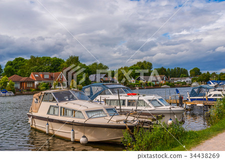 Boats anchored on the bank of the river 34438269