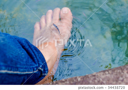 Fish spa in a beautiful blue water Fish spa in a beautiful blue water 34438720