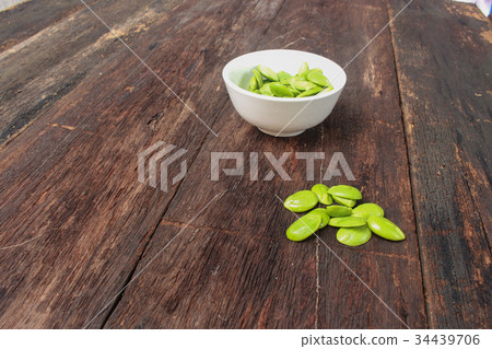 Parkia speciosa in white cup on the wood floor Parkia speciosa in white cup on the wood floor 34439706