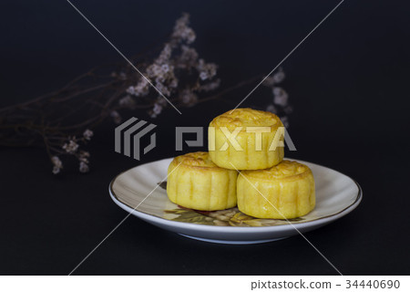 Mid Autumn Festival moon cakes on black background Mid Autumn Festival moon cakes on black background 34440690