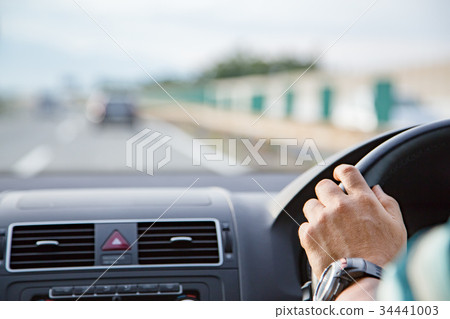 A man driving 34441003