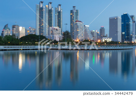 Blue twilight with reflection office building Blue twilight with reflection office building 34442479