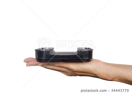 Hand holding black plate isolated on white Hand holding black plate isolated on white 34443770