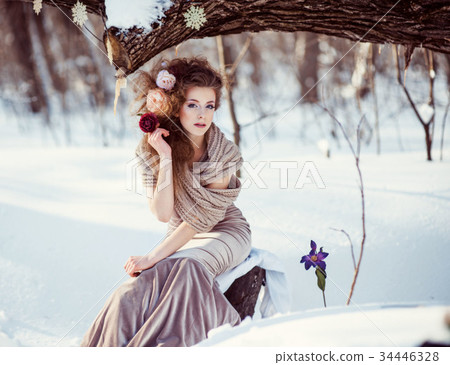 beautiful girl in the winter forest  34446328