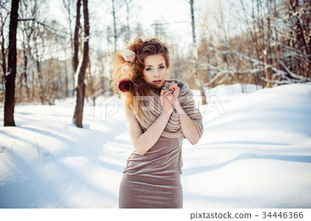 beautiful girl in the winter forest  34446366