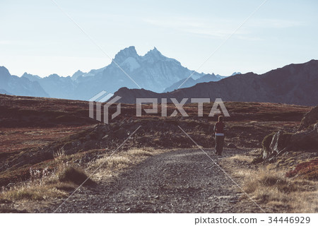Hiker in high altitude rocky mountain landscape. Hiker in high altitude rocky mountain landscape. 34446929