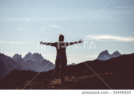 Hiker in high altitude rocky mountain landscape. Hiker in high altitude rocky mountain landscape. 34446930