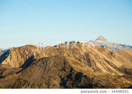 High altitude pasture, rocky mountain peaks High altitude pasture, rocky mountain peaks 34446931