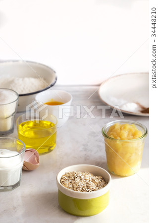 Baking ingredients on white wooden table Baking ingredients on white wooden table 34448210