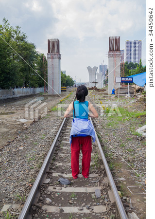 woman standing on Railroad woman standing on Railroad 34450642