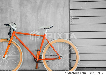 orange bicycle parked decorate interior 34452917