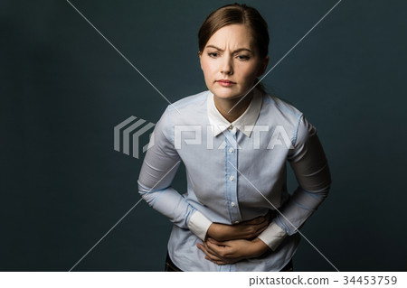Woman with stomachache Woman with stomachache 34453759