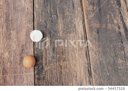 Shell of the egg on wooden table background Shell of the egg on wooden table background 34457320