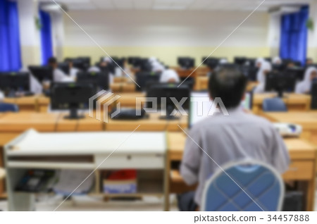 Student with teacher and desktop computer. Blur Student with teacher and desktop computer. Blur 34457888