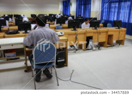 Student with teacher and desktop computer. Blur  34457889