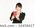 Correspondence to overseas business trips is a business person's essential skill. Business woman holding a passport 34458417
