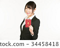 Correspondence to overseas business trips is a business person's essential skill. Business woman holding a passport 34458418