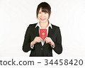 Correspondence to overseas business trips is a business person's essential skill. Business woman holding a passport 34458420