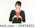 Correspondence to overseas business trips is a business person's essential skill. Business woman holding a passport 34458422