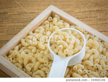 Elbow Macaroni or Gomiti Pasta in Measuring Cup 34460106