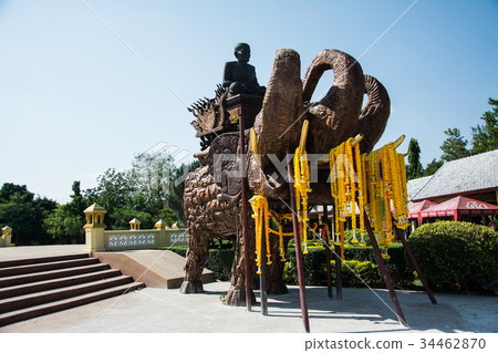 The statue of the monk looks calm. 34462870