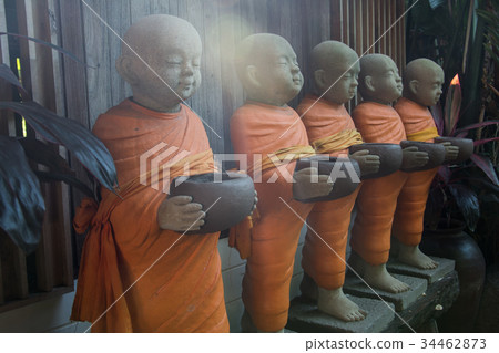 The statue of the monk looks calm. The statue of the monk looks calm. 34462873