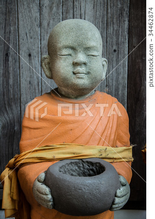 The statue of the monk looks calm. The statue of the monk looks calm. 34462874