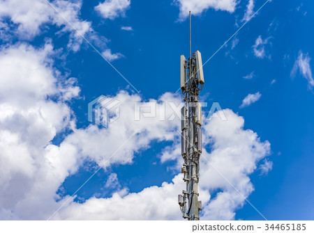 Cellular antenna against blue sky telecommunicatio Cellular antenna against blue sky telecommunicatio 34465185